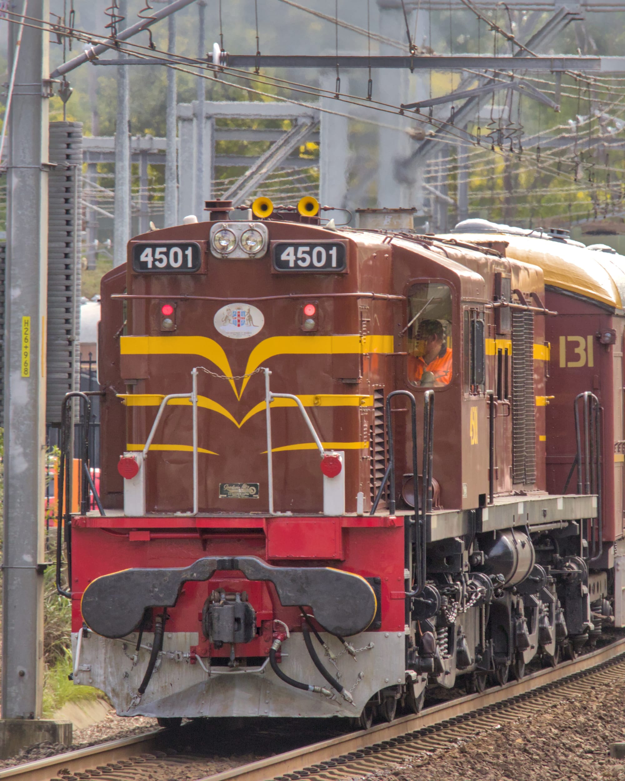 Close front view of 4501 surrounded by dense overhead wiring